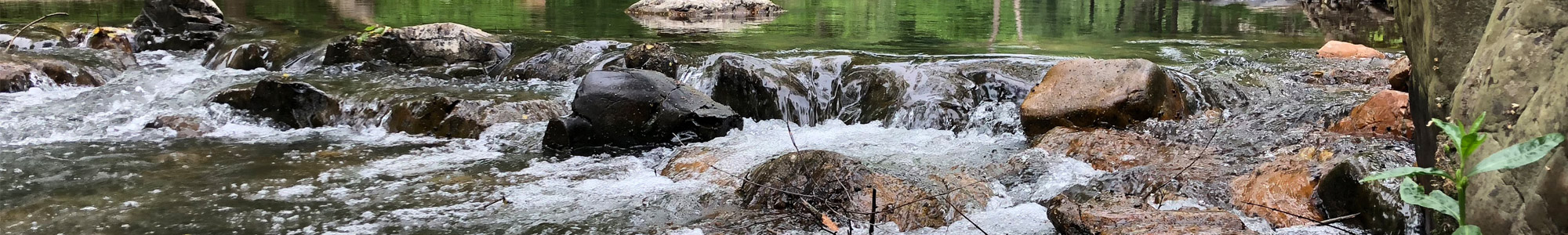 water rushing over river rocks