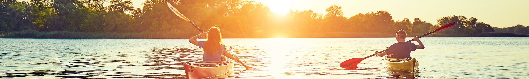 people kayaking on a river